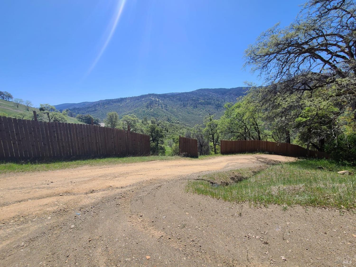 35776 Mendocino Pass Road Covelo, CA 95428 - Photo 2 of 33 a backyard of a house with lots of green space