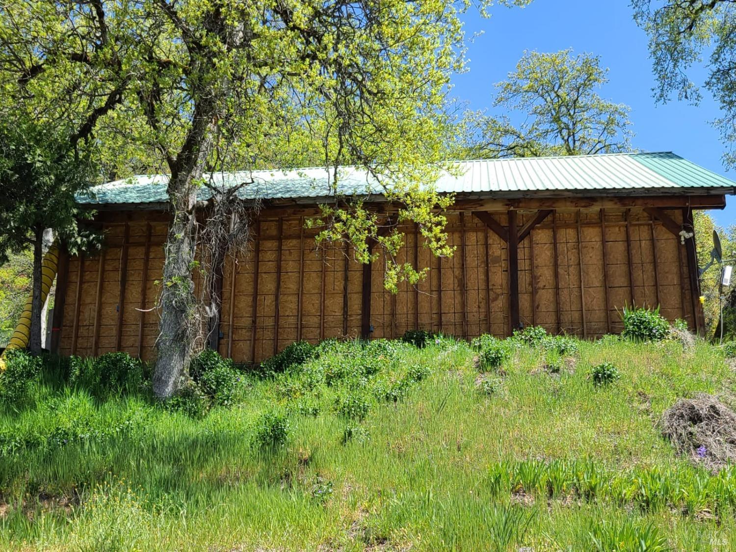 35776 Mendocino Pass Road Covelo, CA 95428 - Photo 25 of 33 a backyard of a house with lots of green space