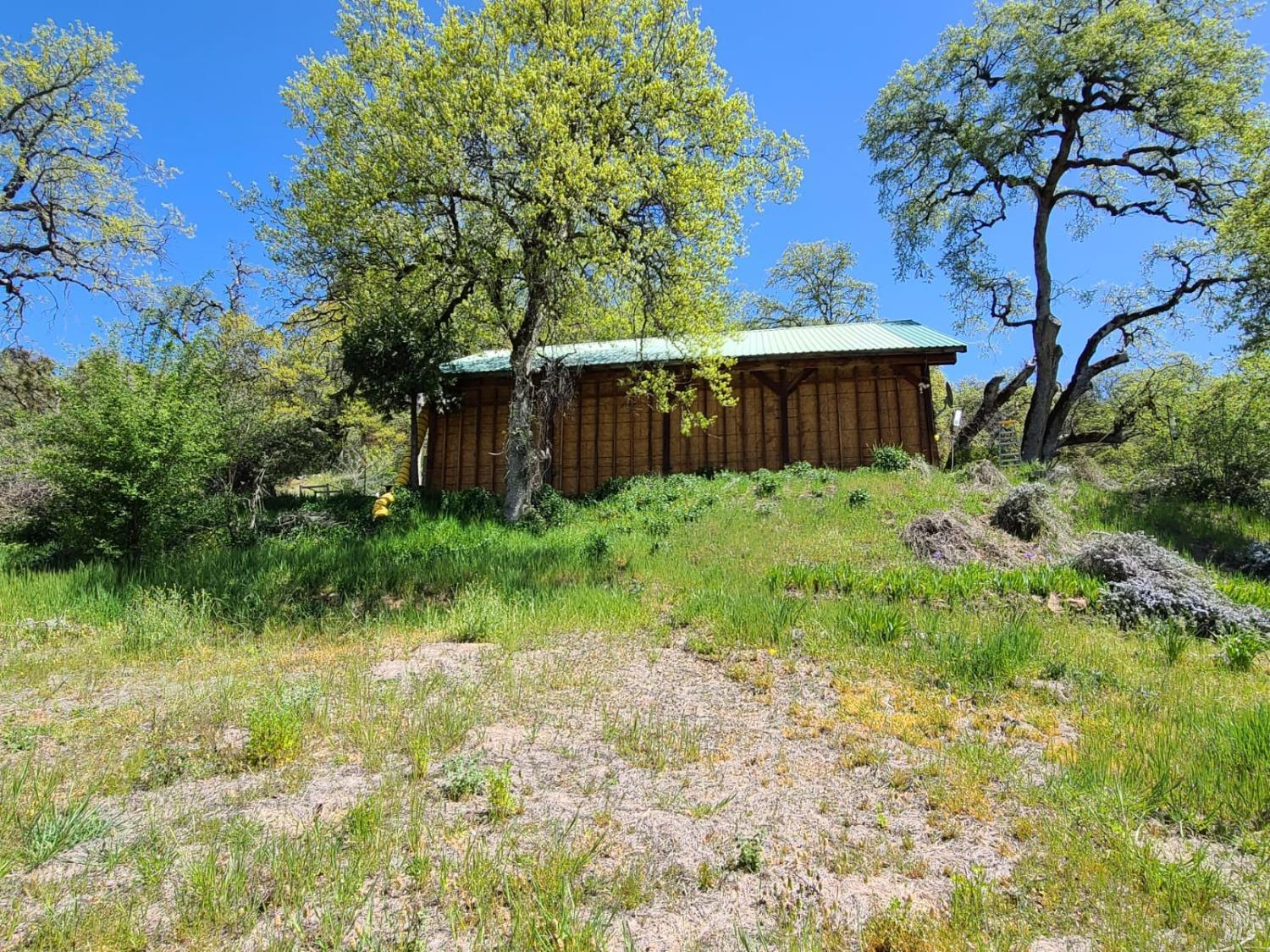 35776 Mendocino Pass Road Covelo, CA 95428 - Photo 26 of 33 a view of backyard with wooden fence and large trees