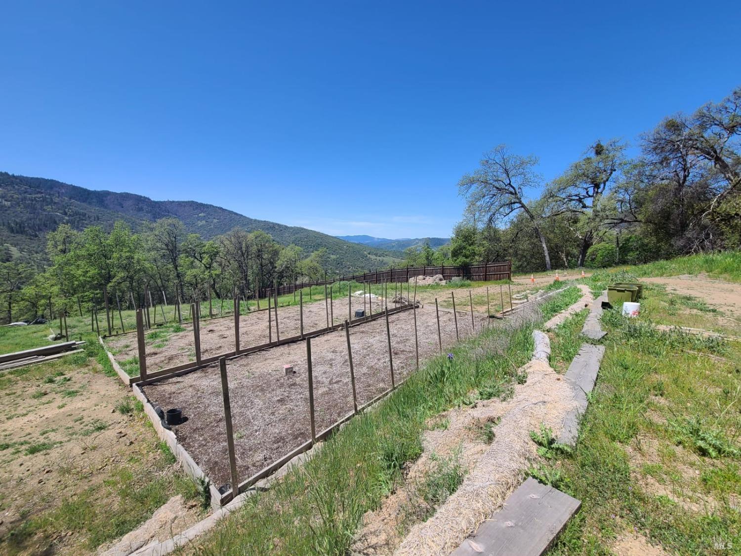 35776 Mendocino Pass Road Covelo, CA 95428 - Photo 10 of 33 a view of a pathway with a wrought fence