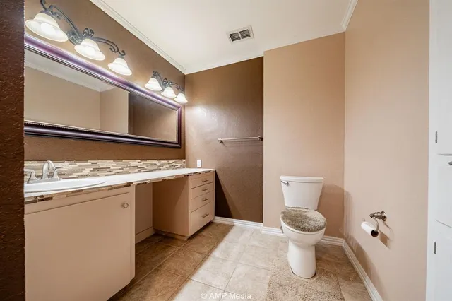 a bathroom with a sink and a toilet