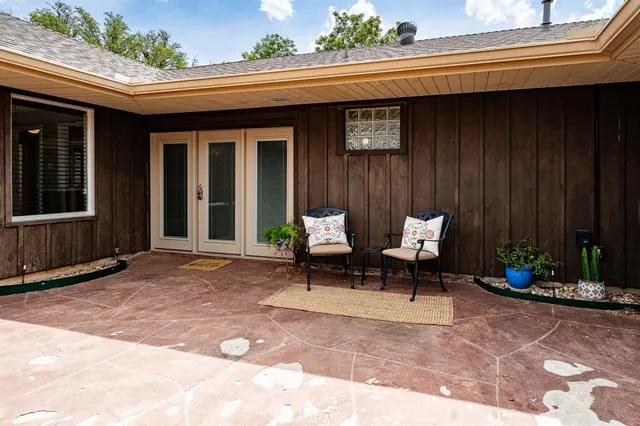 a view of a swimming pool with a yard