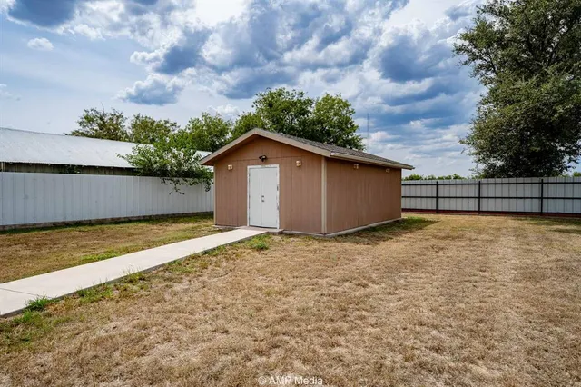 an aerial view of a houses with outdoor space and street view