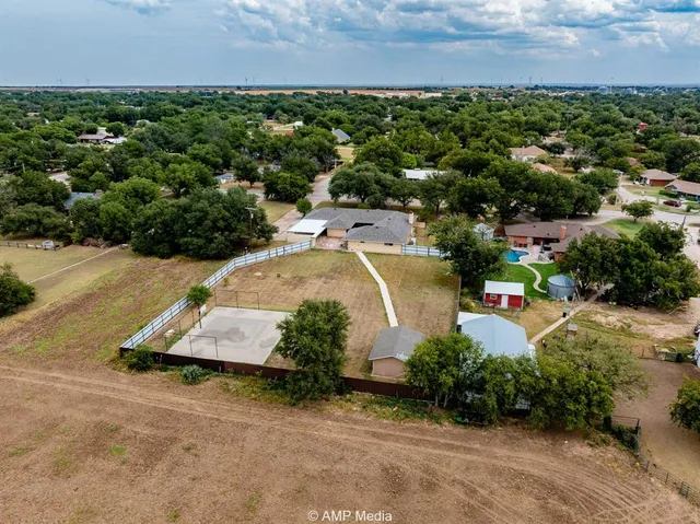 an aerial view of a house with a garden