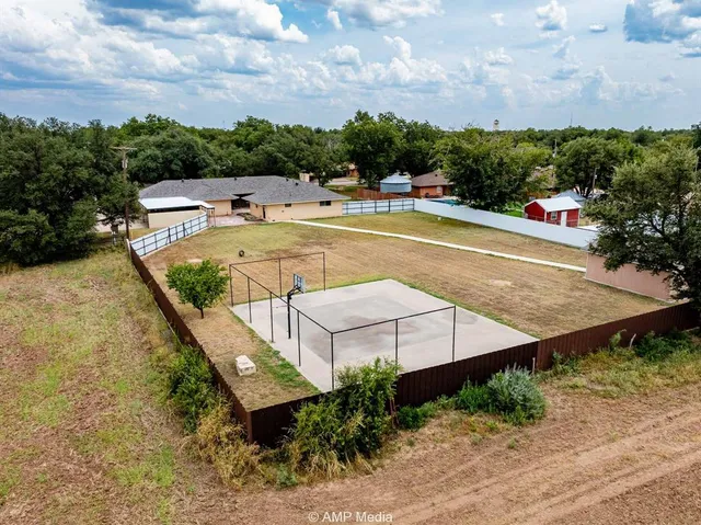 a view of a large trees in front of a house