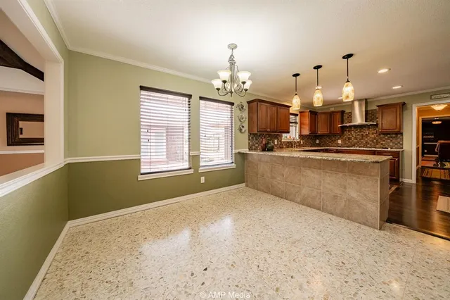 a open kitchen with kitchen island a stove a sink dishwasher and a refrigerator