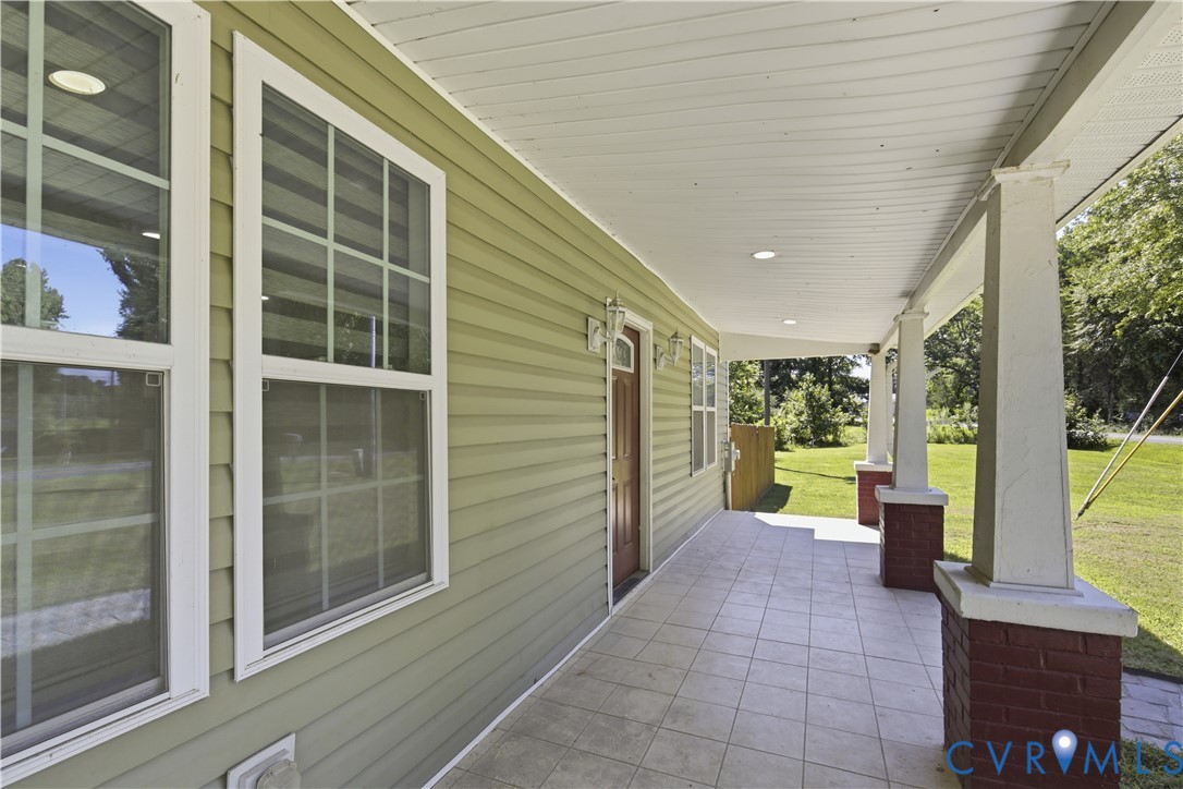 36 Columbia Road Cartersville, VA 23027 - Photo 6 of 35 Inviting covered porch with a tiled floor, white c
