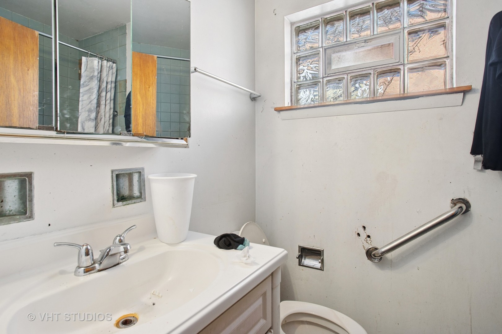 9407 South Normal Avenue Chicago, IL 60620 - Photo 11 of 18 a bathroom with a sink and a mirror