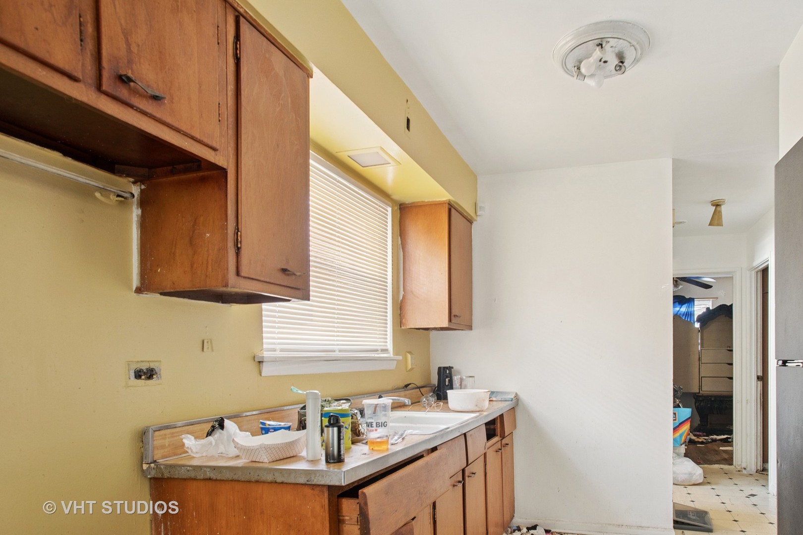 9407 South Normal Avenue Chicago, IL 60620 - Photo 4 of 18 a bathroom with a granite countertop sink and a mirror