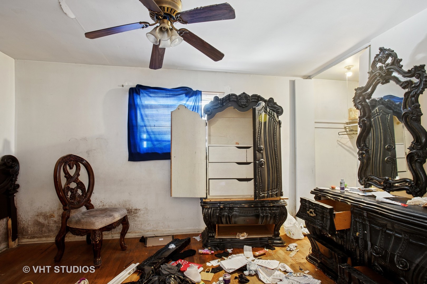 9407 South Normal Avenue Chicago, IL 60620 - Photo 9 of 18 a bedroom with a bed and a chandelier