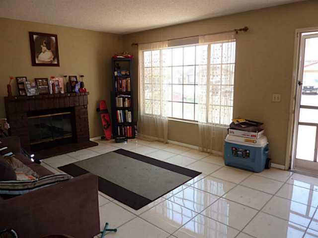 7666 Dancy Road San Diego, CA 92126 - Photo 3 of 12 Family Room with Fireplace