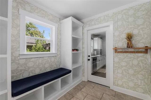 a kitchen with a refrigerator and a window