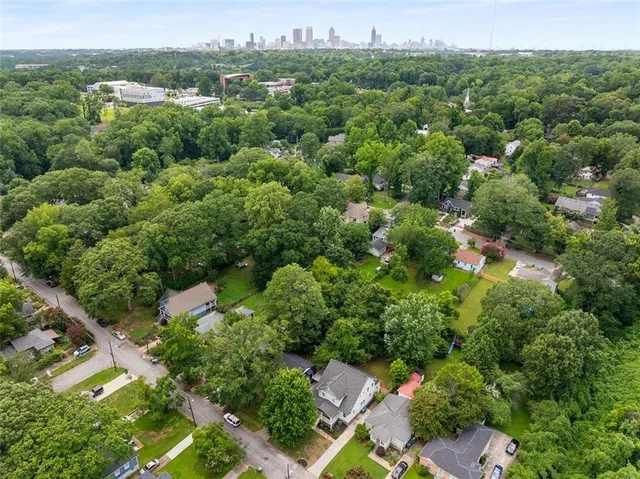 an aerial view of a house with a yard