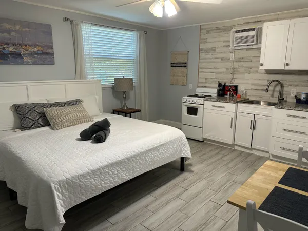 a bedroom with a bed and a cabinets