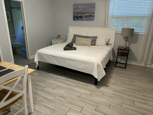 a bedroom with a bed and a table in it