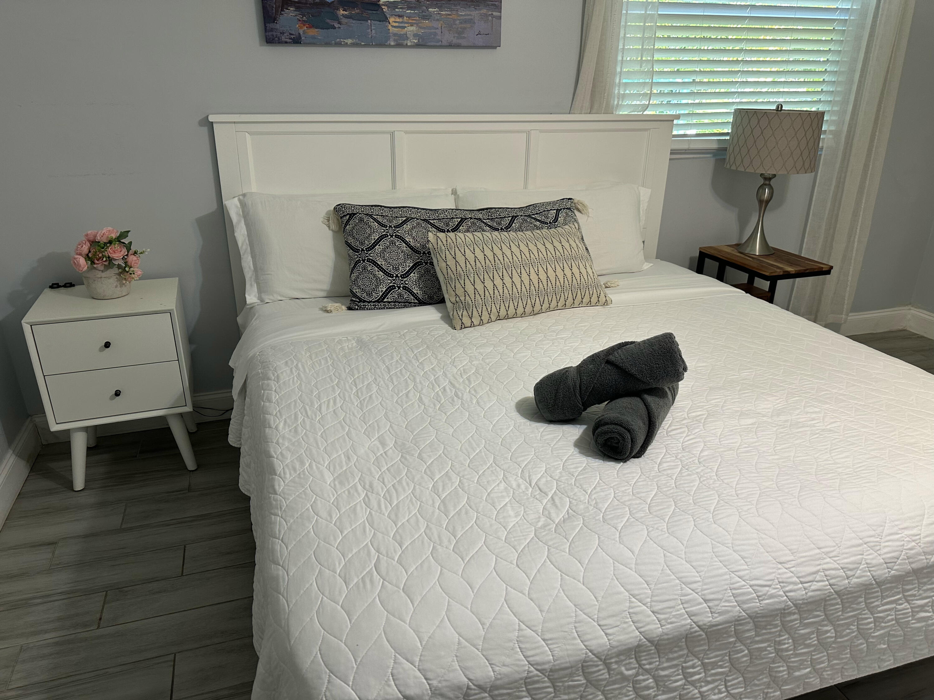 1258 Beach Road, Unit 9 STUDIO Singer Island, FL 33404 - Photo 8 of 13 a bedroom with a bed and a white cabinet