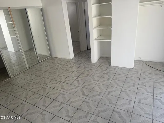 a view of an empty walk in closet