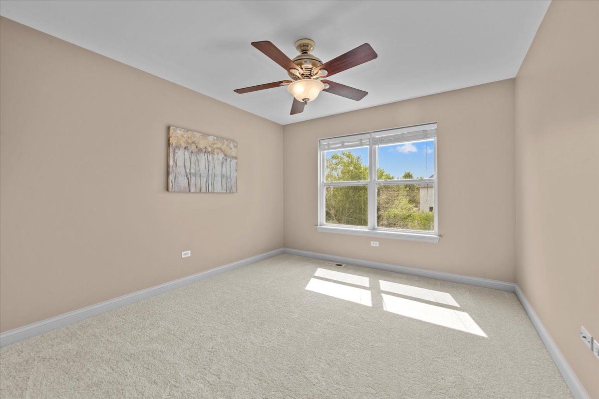 1112 Stonehaven Circle Aurora, IL 60504 - Photo 22 of 28 a view of an empty room with a window