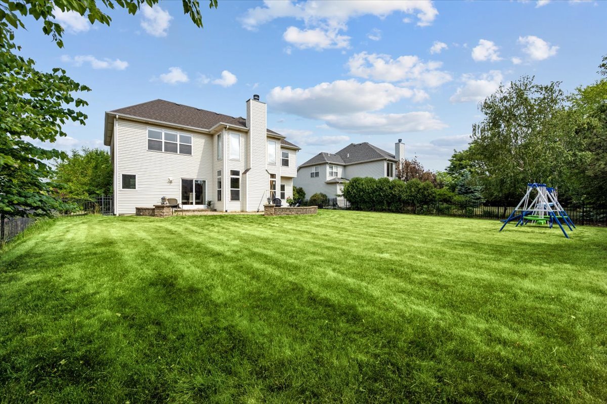 1112 Stonehaven Circle Aurora, IL 60504 - Photo 27 of 28 a front view of a house with a yard