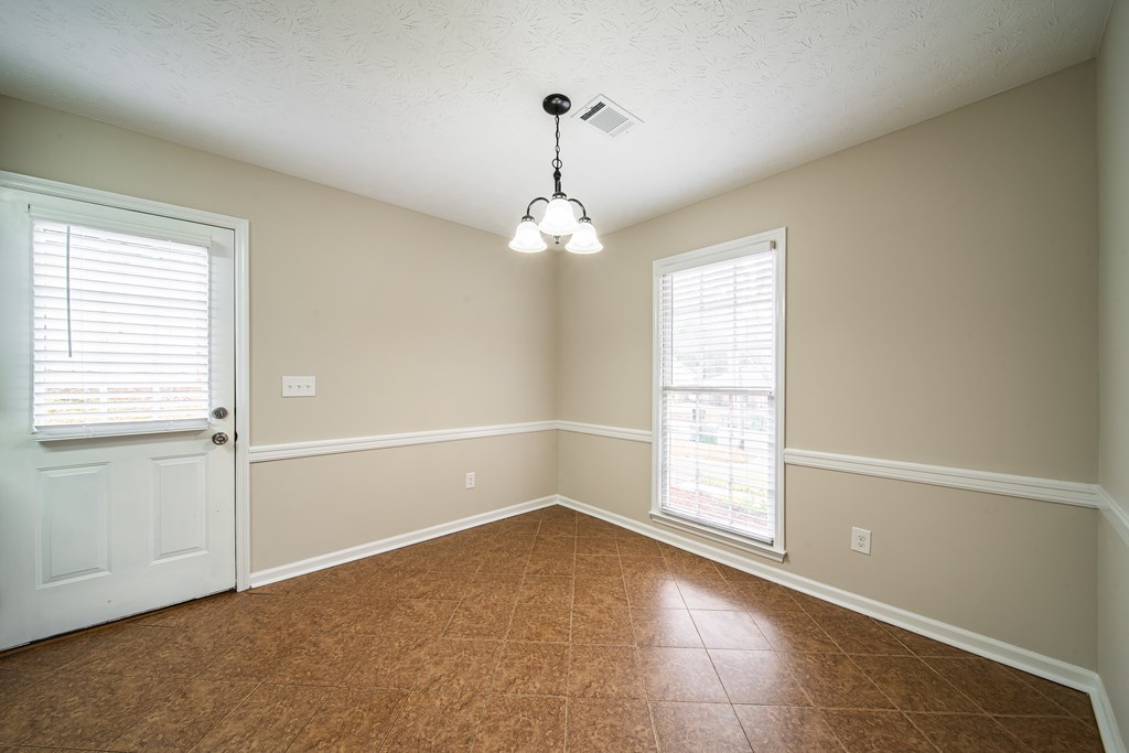 907 Eden Street Columbus, GA 31904 - Photo 13 of 26 a view of a room with windows and chandelier