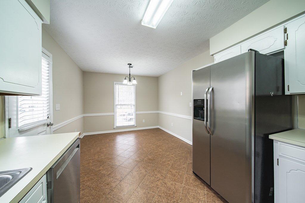 907 Eden Street Columbus, GA 31904 - Photo 16 of 26 a view of a kitchen with a sink and refrigerator