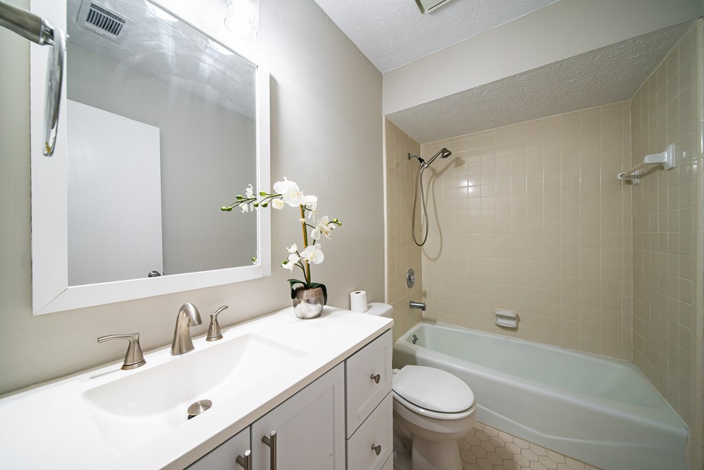 907 Eden Street Columbus, GA 31904 - Photo 18 of 26 a bathroom with a sink a toilet and a mirror