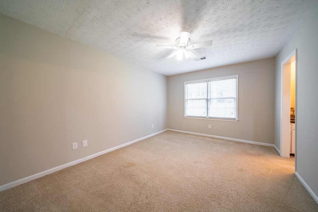 907 Eden Street Columbus, GA 31904 - Photo 21 of 26 an empty room with a window and a fan