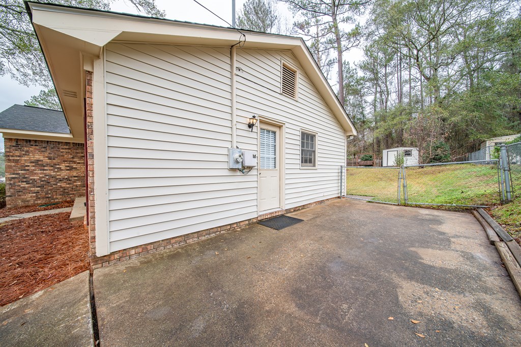 907 Eden Street Columbus, GA 31904 - Photo 4 of 26 a view of a house with a yard and garage