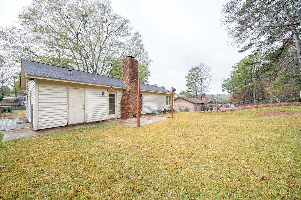 907 Eden Street Columbus, GA 31904 - Photo 6 of 26 a view of a house with a yard and garage