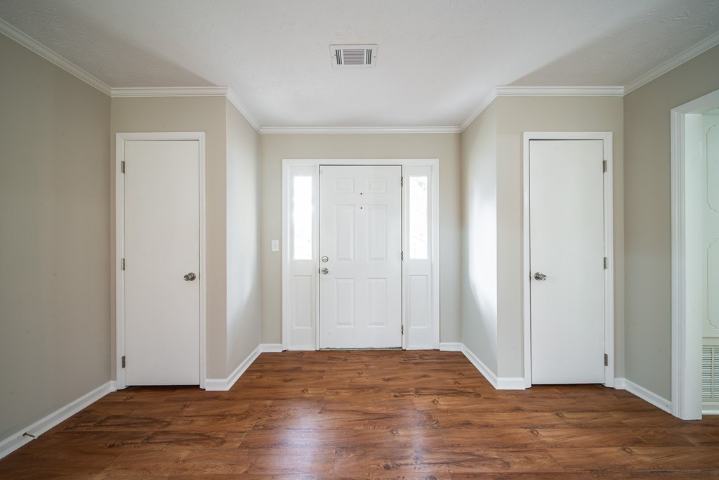 907 Eden Street Columbus, GA 31904 - Photo 9 of 26 a view of empty room with wooden floor