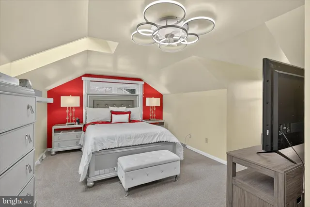 a view of a livingroom with furniture and a flat screen tv