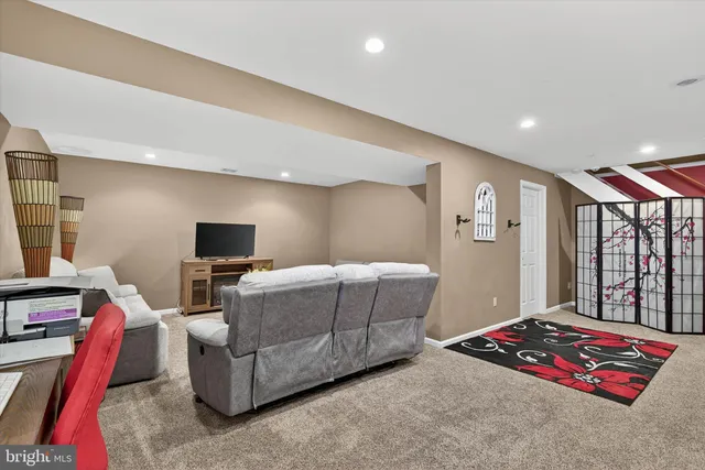 a view of a backyard with plants and large tree