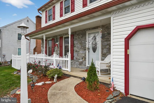 a front view of a house with a porch