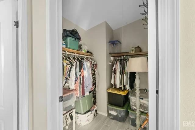 a kitchen with granite countertop a stove top oven sink and cabinets