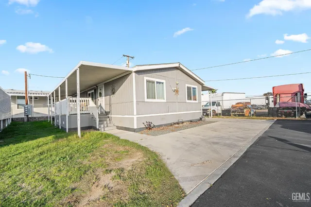 a house view with a backyard space