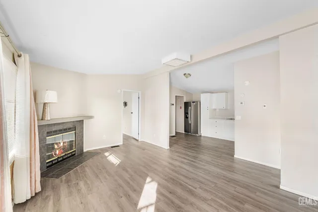 a kitchen with stainless steel appliances a sink stove and refrigerator
