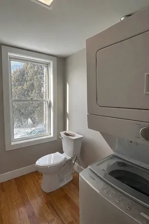 a living room with a couch and windows