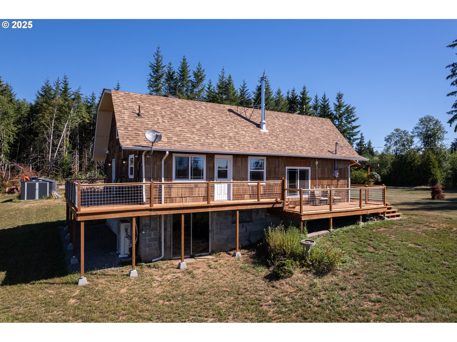 70392 Schumacher Road Rainier, OR 97048 - Photo 24 of 42 a front view of a house with a garden