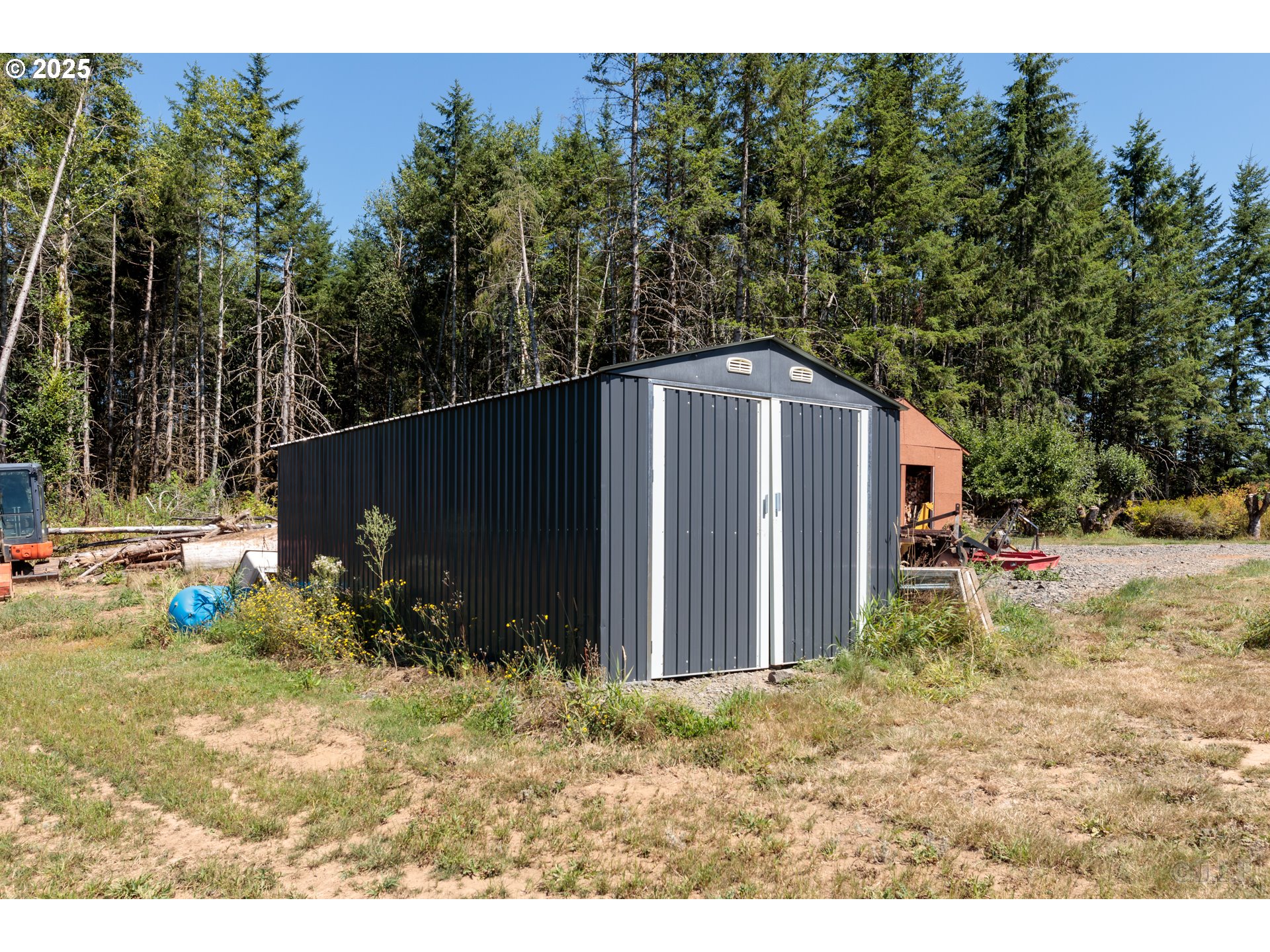 70392 Schumacher Road Rainier, OR 97048 - Photo 29 of 42 a backyard of a house with lots of green space