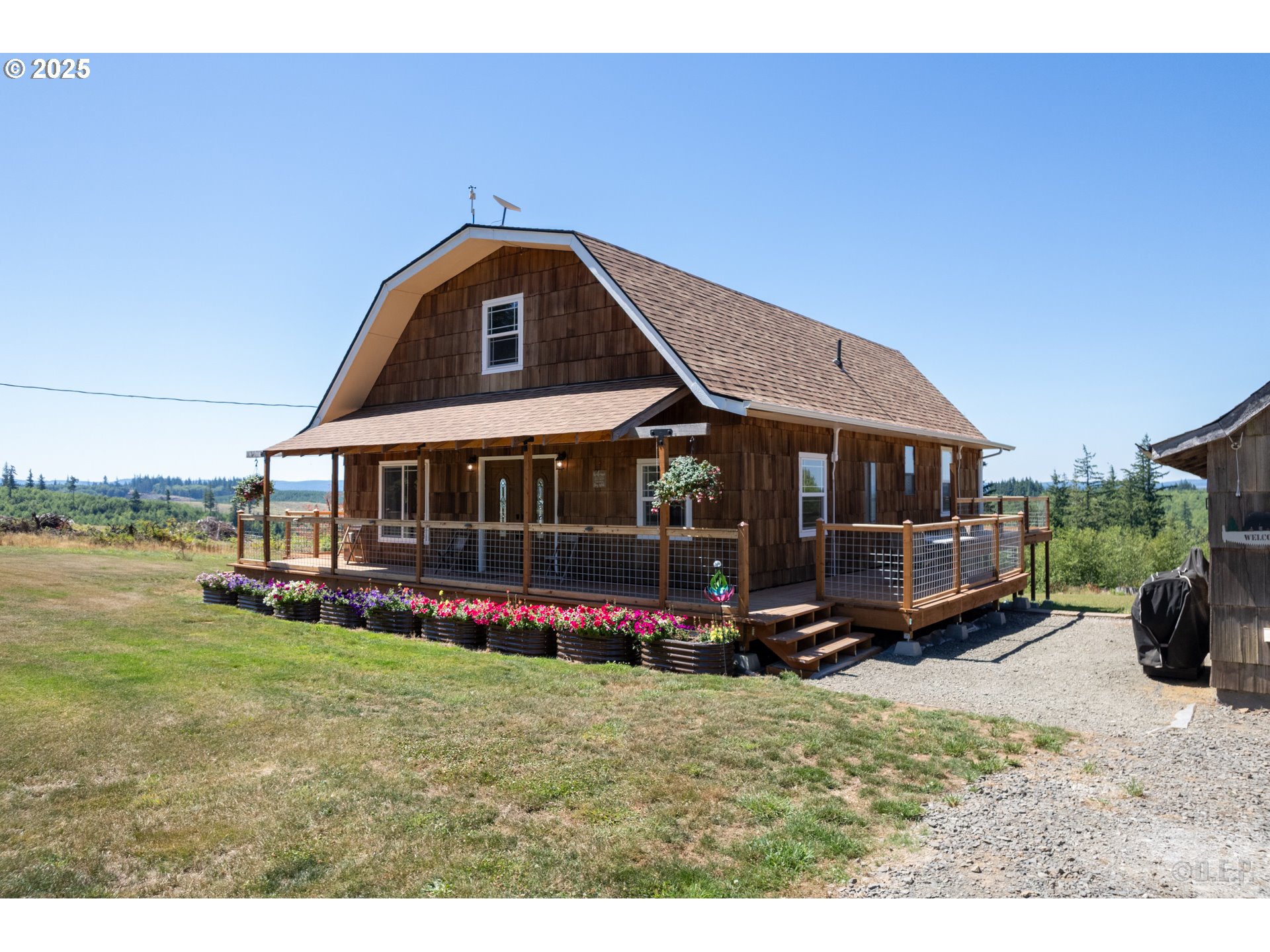 70392 Schumacher Road Rainier, OR 97048 - Photo 34 of 42 a view of a house with yard and sitting area