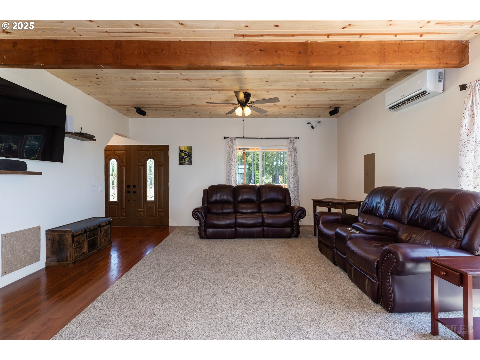 70392 Schumacher Road Rainier, OR 97048 - Photo 5 of 42 a living room with furniture a flat screen tv and kitchen view