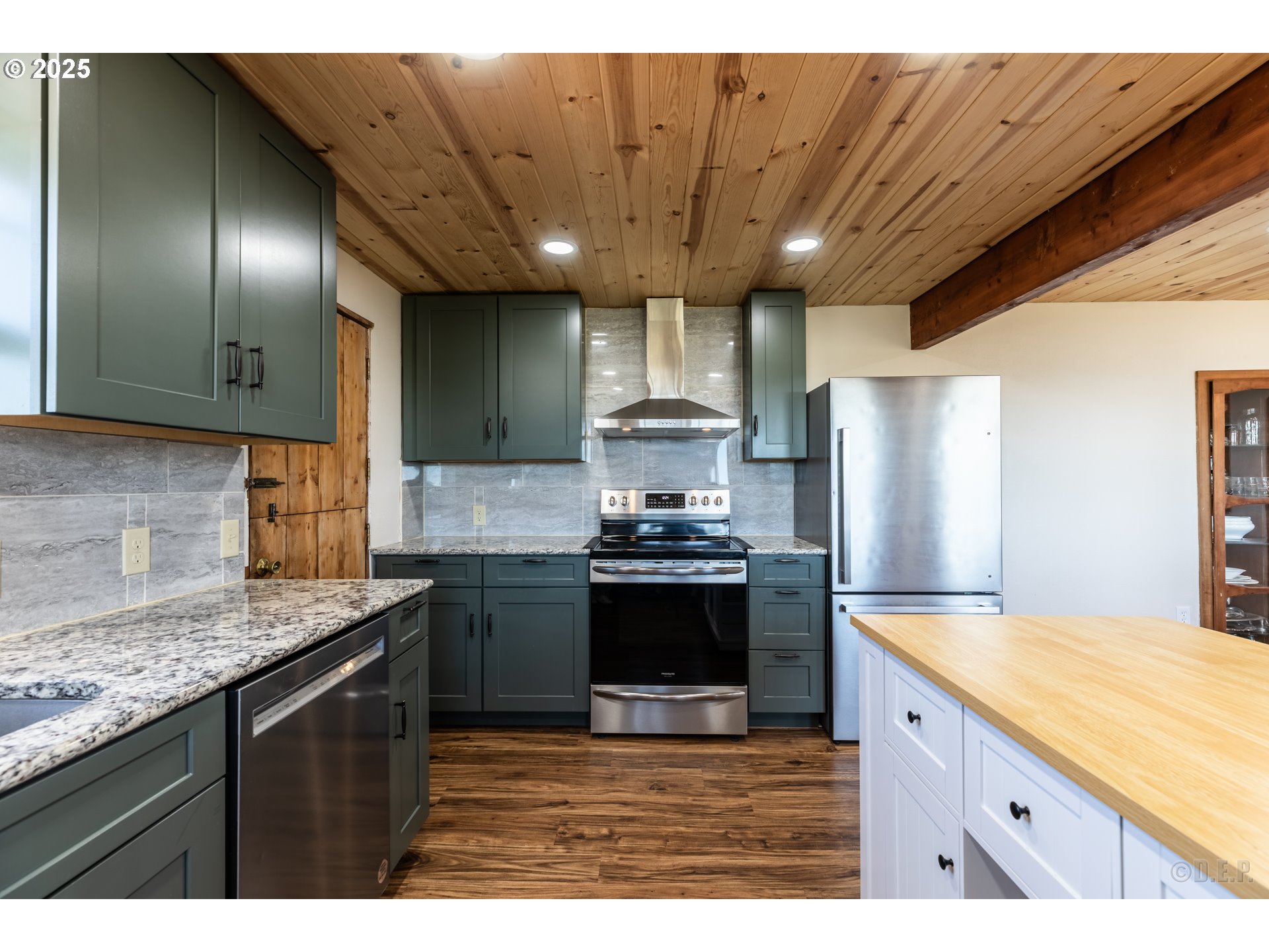 70392 Schumacher Road Rainier, OR 97048 - Photo 10 of 42 a kitchen with stainless steel appliances granite countertop a sink a stove and a refrigerator
