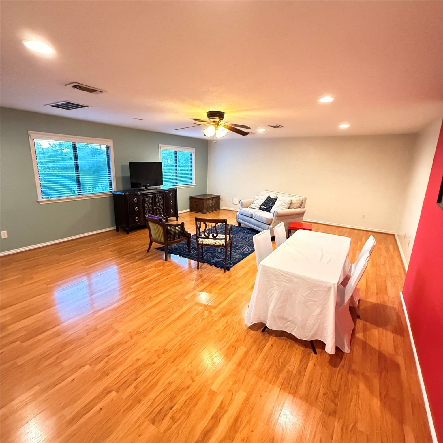 7338 Birchtree Forest Drive, Unit A Houston, TX 77088 - Photo 2 of 10 a living room with furniture and a flat screen tv