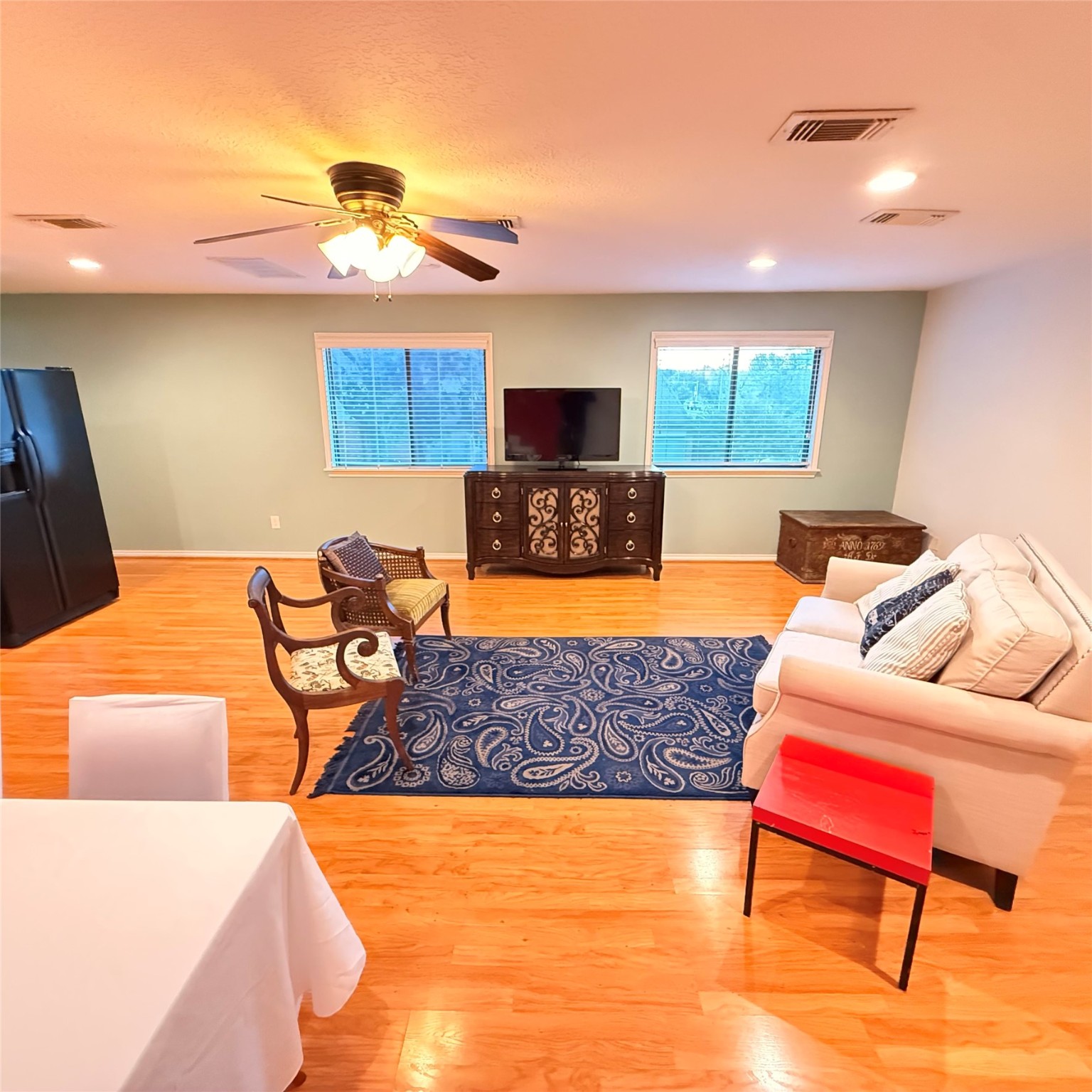 7338 Birchtree Forest Drive, Unit A Houston, TX 77088 - Photo 3 of 10 a living room with furniture and a lamp