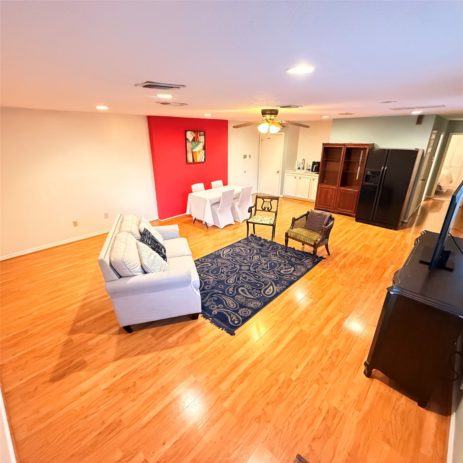 7338 Birchtree Forest Drive, Unit A Houston, TX 77088 - Photo 4 of 10 a living room with furniture and wooden floor