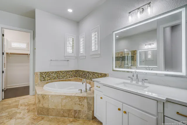 a bathroom with a bathtub sink and toilet