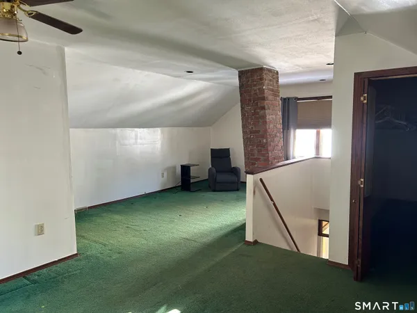 a view of empty room with windows