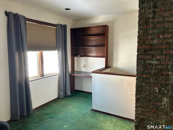 a kitchen with a refrigerator and a stove