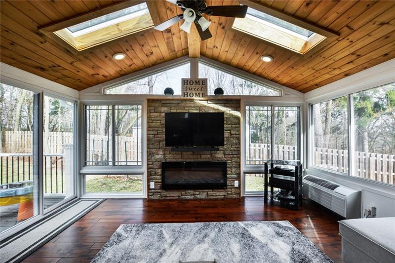 5415 Hardt Road Gibsonia, PA 15044 - Photo 8 of 22 Four seasons room with an electric fireplace and skylights.