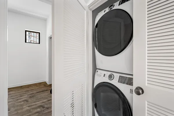 a view of a hallway with washer and dryer